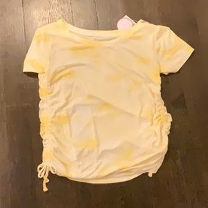 a yellow and white tie dye t-shirt